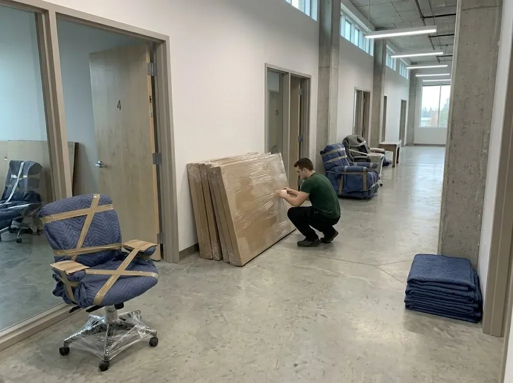 Stacked cardboard panels wrapped in protective plastic film